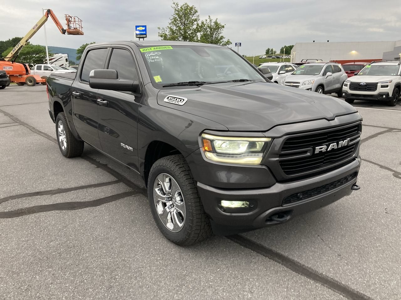 2019 RAM 1500 Big Horn/Lone Star in Granite Crystal Metallic Clearcoat — front three-quarter view