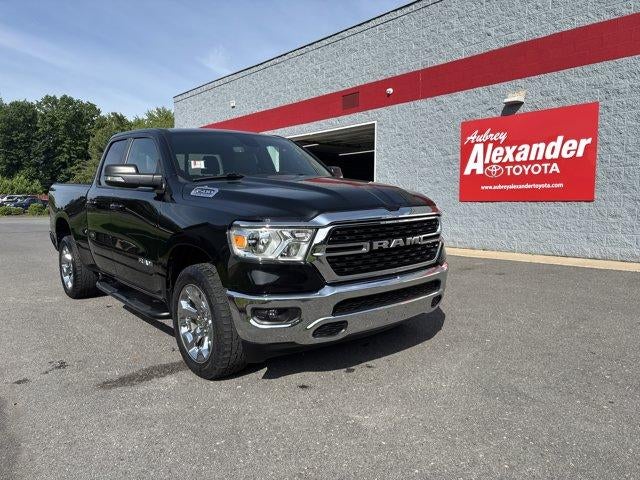 2022 RAM 1500 Big Horn 4x4 Quad Cab 6'4" Box in Diamond Black Crystal Pearlcoat — front three-quarter view