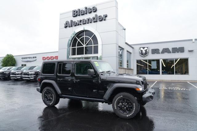 2022 Jeep Wrangler Unlimited Willys 4x4 in Black Clearcoat — front three-quarter view