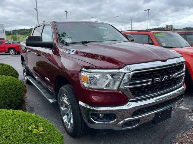 2022 RAM 1500 Big Horn 4x4 Crew Cab 5'7" Box in Delmonico Red Pearlcoat — front three-quarter view