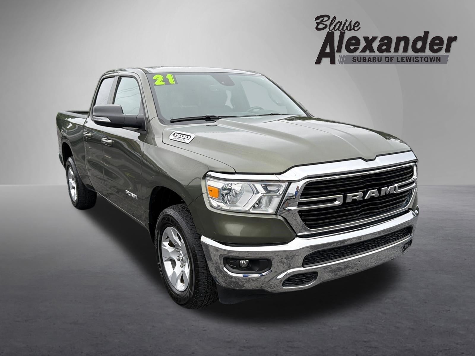 2021 RAM 1500 Big Horn 4x4 Quad Cab 6'4" Box in Olive Green Pearlcoat — front three-quarter view