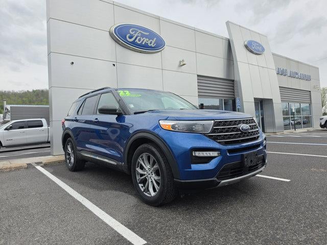 2022 Ford Explorer XLT 4WD in Atlas Blue Metallic — front three-quarter view