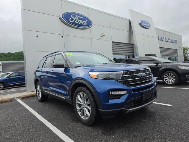 2023 Ford Explorer XLT 4WD in Atlas Blue Metallic — front three-quarter view